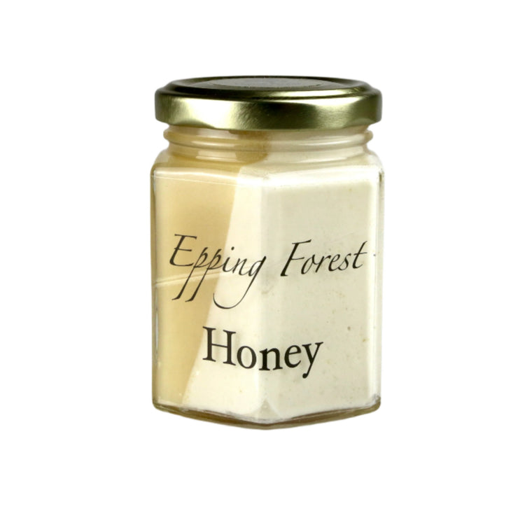 Jar of Epping Forest Honey on a gray background