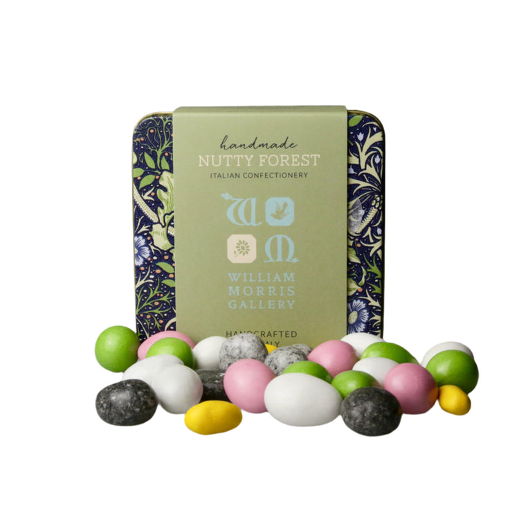 Decorative tin with 'Nutty Forest' branding surrounded by colorful candies on a gray background