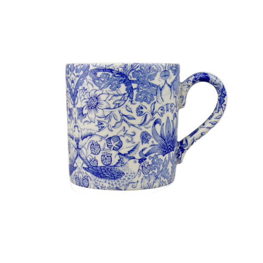 Blue and white patterned mug on a white background
