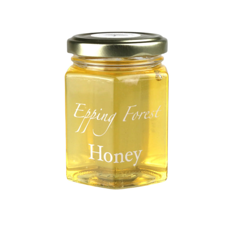 Jar of Epping Forest Honey on a light gray background