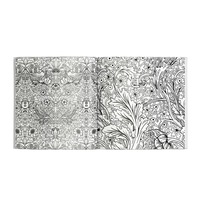 Two coloring books with intricate black and white patterns on a gray background