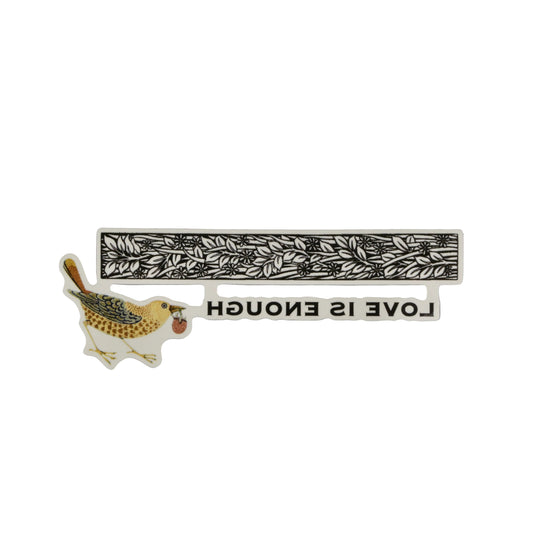 Decorative item with a bird illustration and 'LOVE IS ENOUGH' text on a gray background