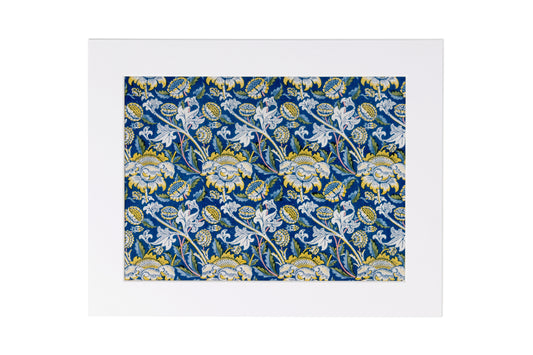 A framed art print featuring a classic William Morris-style floral and paisley pattern in navy blue, white, and yellow, set against a clean white background.