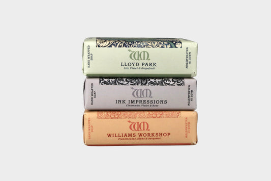 Three bars of soap stacked on a gray background with 'Lloyd Park', 'Ink Impressions', and 'Williams Workshop' branding.