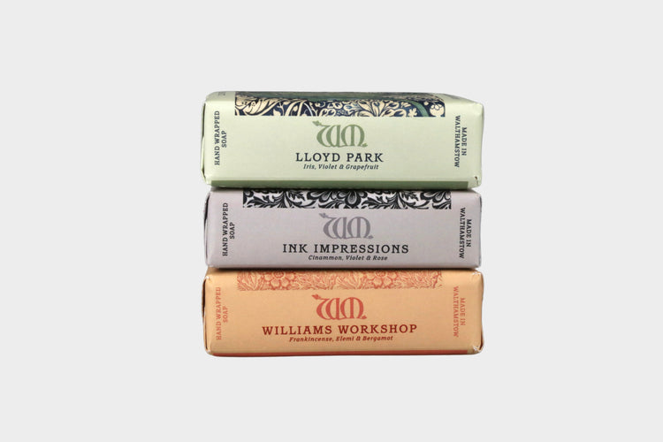 Three bars of soap stacked on a gray background with 'Lloyd Park', 'Ink Impressions', and 'Williams Workshop' branding.