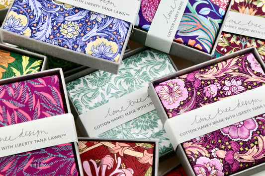 Collection of colorful fabric samples with Liberty Tana Lawn branding.