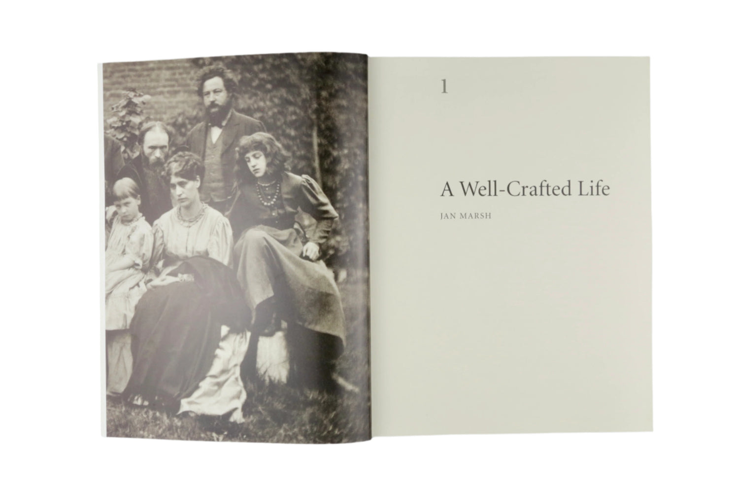 Book open to a page with an old photograph of a family and text 'A Well-Crafted Life'.