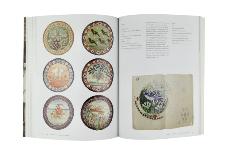 Open book showing illustrations of decorative plates on a gray background