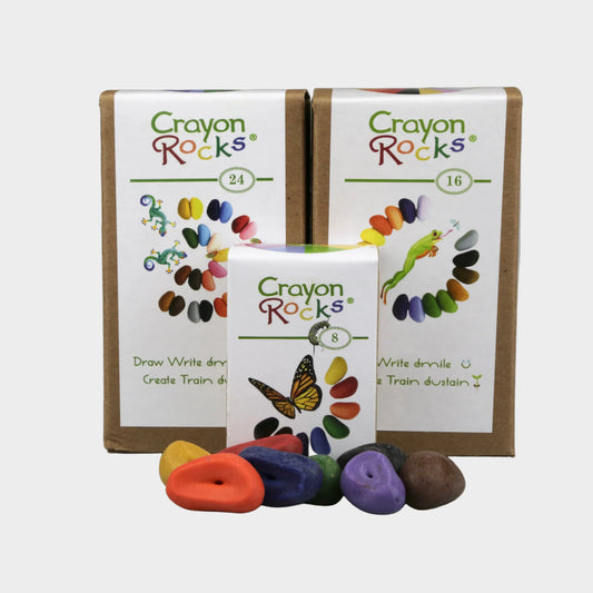 Crayon Rocks packaging with colorful rocks on a gray background