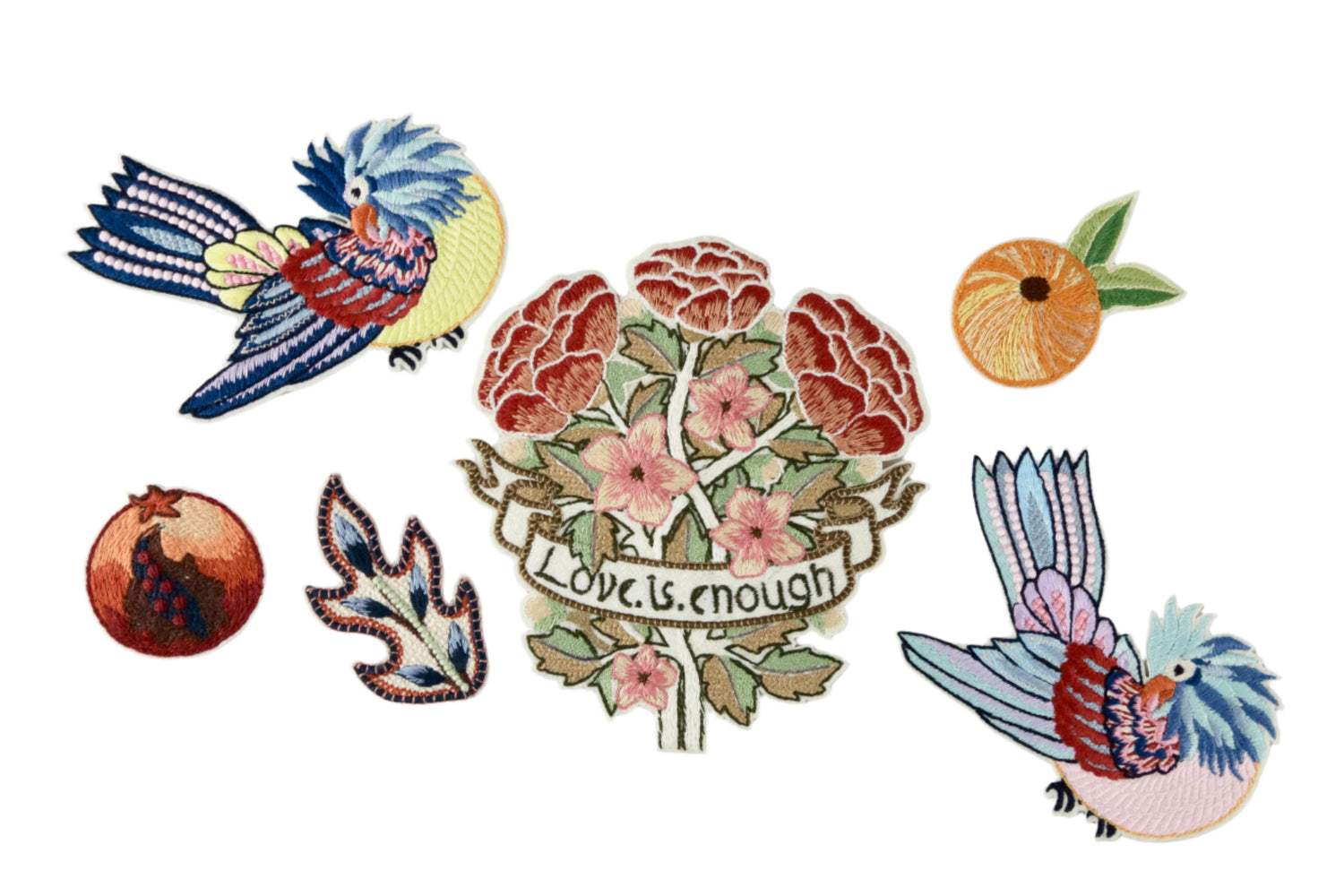 Set of colorful embroidered patches featuring birds and floral designs on a gray background.