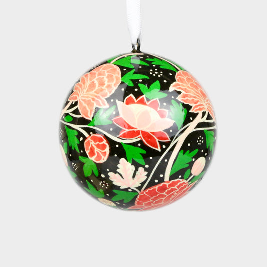 Decorative ornament with floral design on a plain background