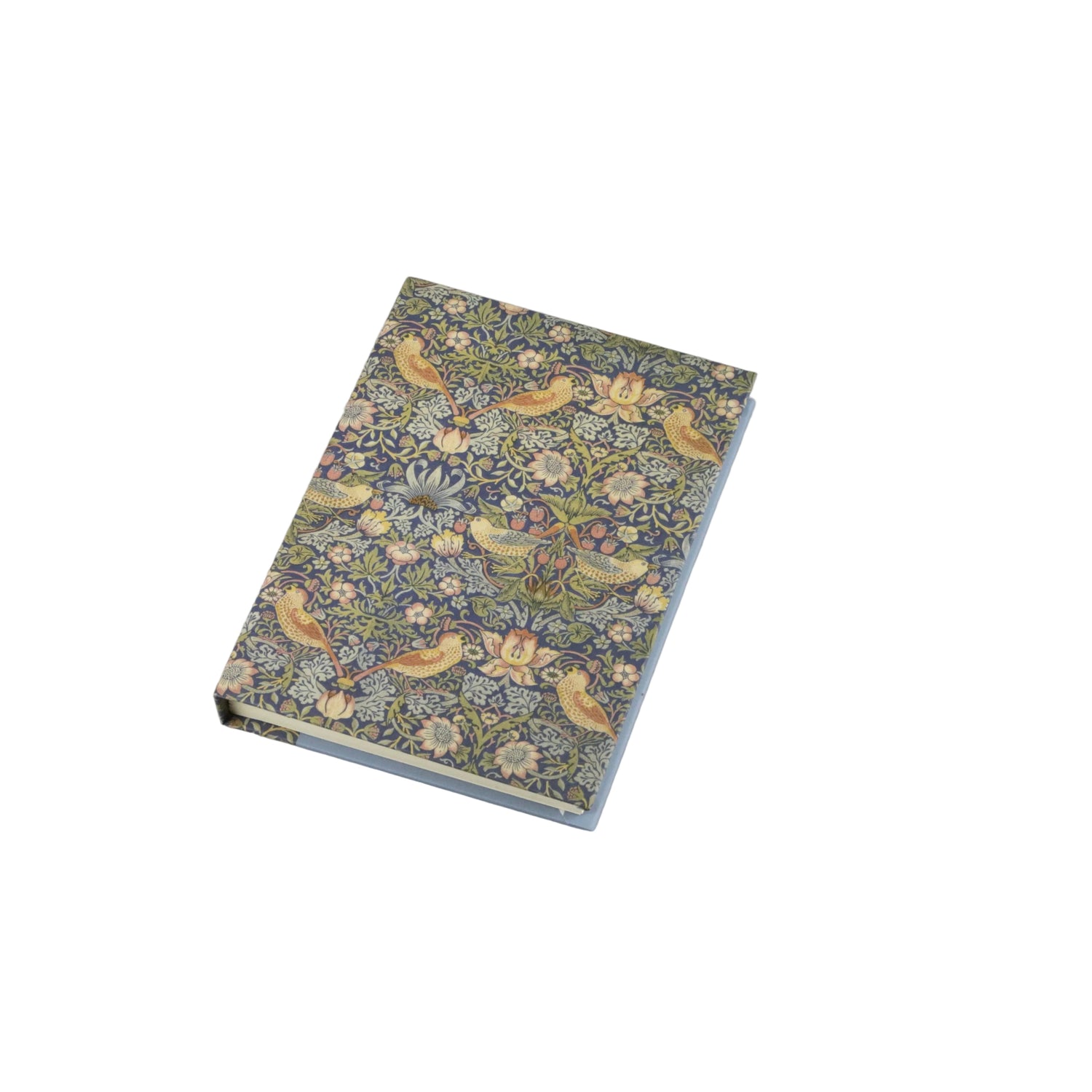 A small rectangular book or notebook with a dense floral and bird patterned cover, photographed on a plain light gray background.