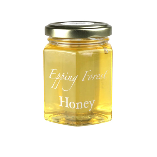 Jar of Epping Forest Honey on a light gray background