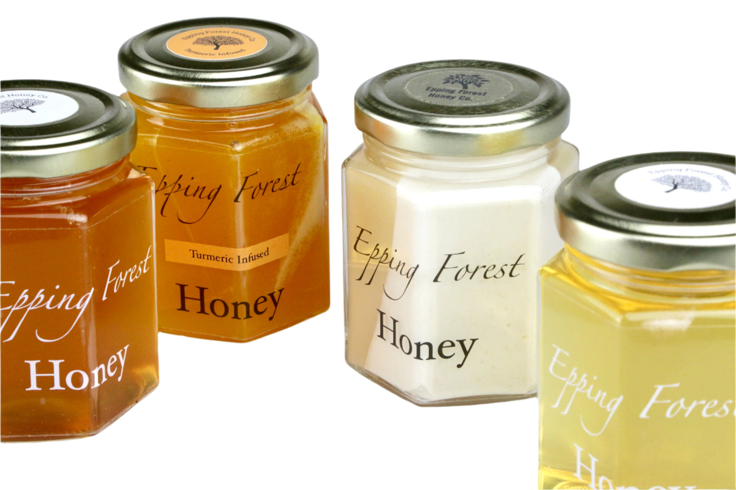 Four jars of Epping Forest Honey on a white background