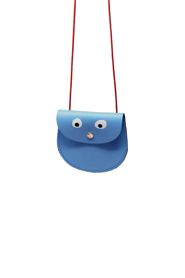 Blue bag with eyes and a nose on a pink background