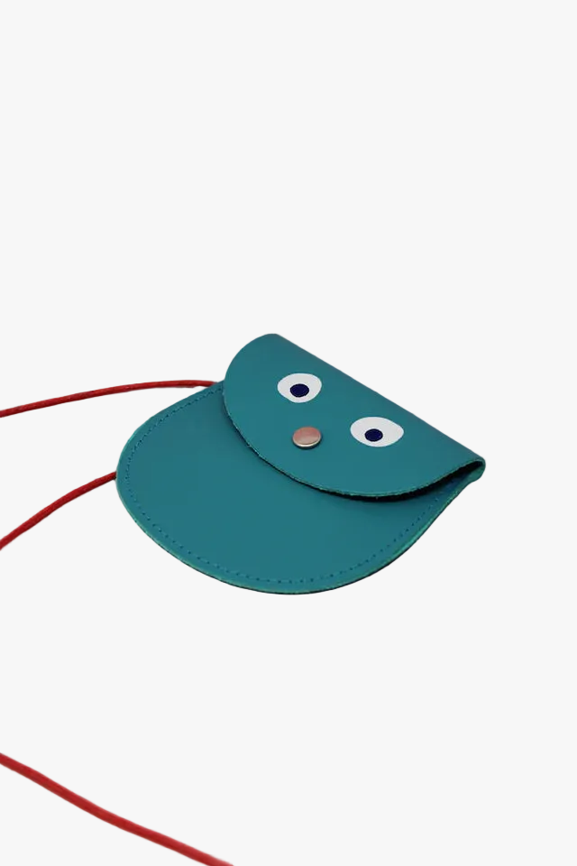 Teal pouch with a red strap on a pink background