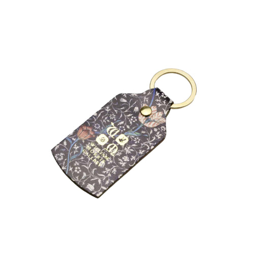 Keychain with floral pattern on a gray background