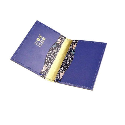 Open purple wallet with floral lining on a light gray background